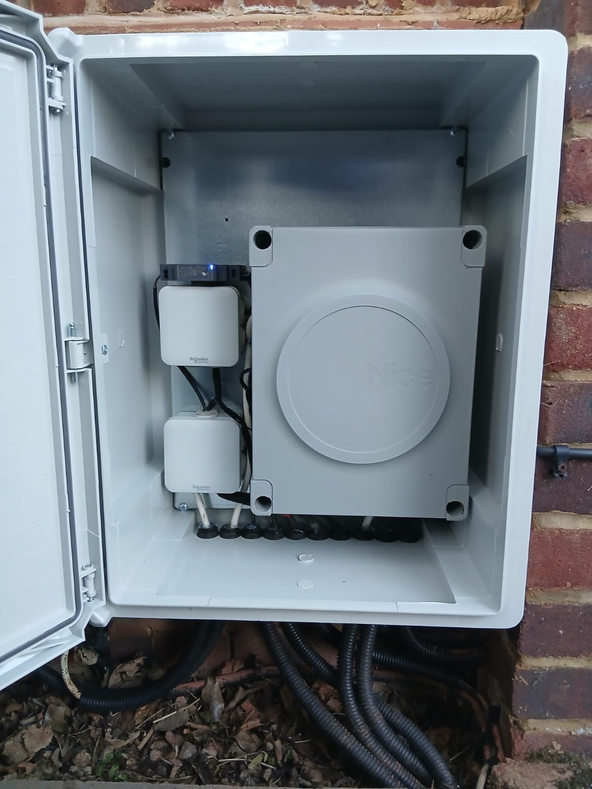 The same gate rebuilt with a clean weatherproof enclosure, a Nice controller and sealed cable glands
